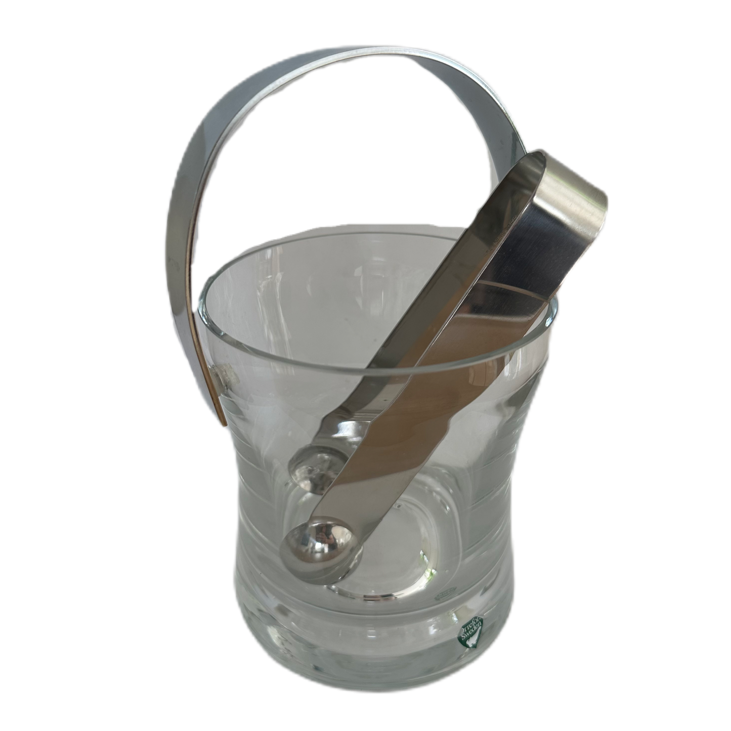 Ishink i glas från Orrefors med tång i metall.