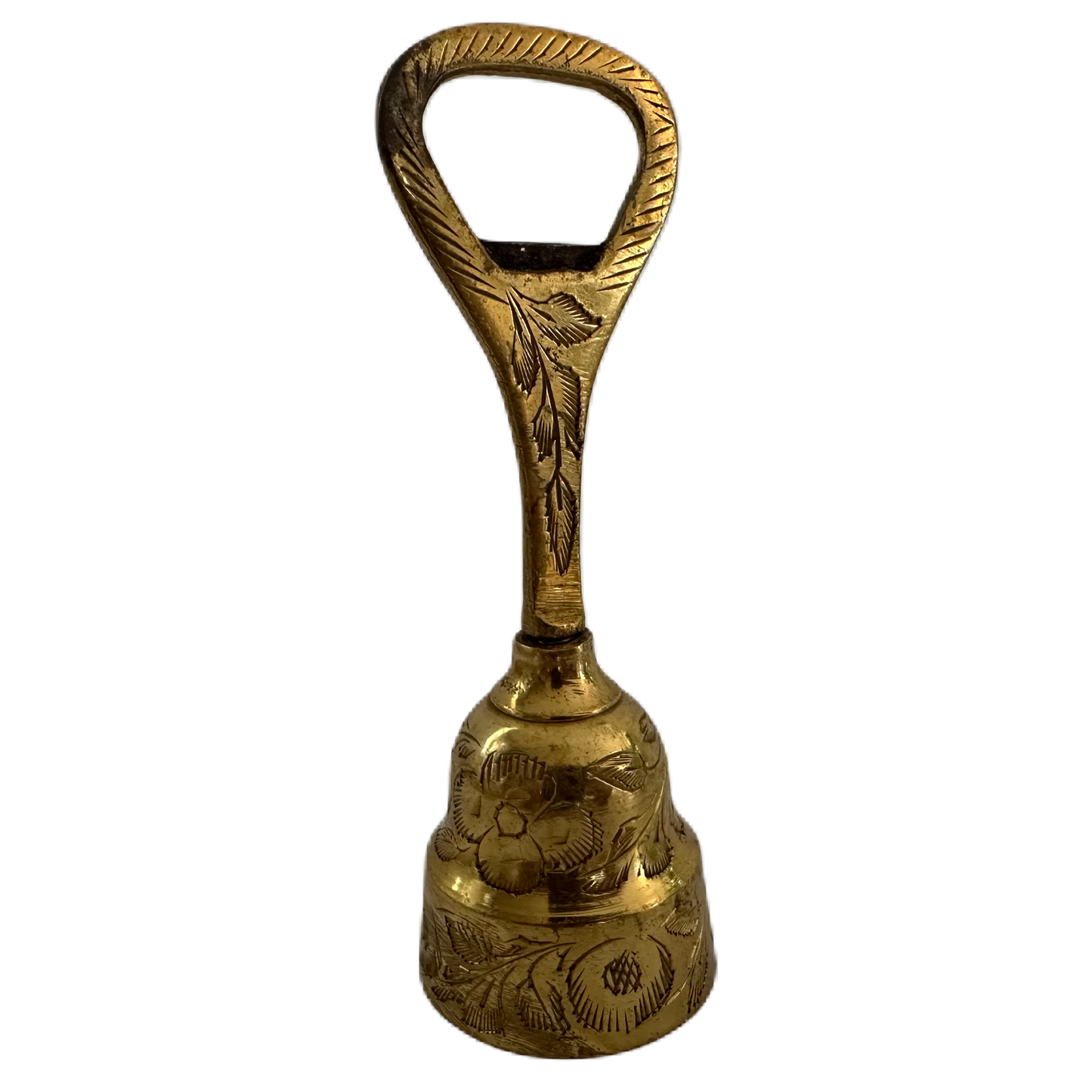 Mässingsfärgad bordsklocka med flasköppnare och dekor.