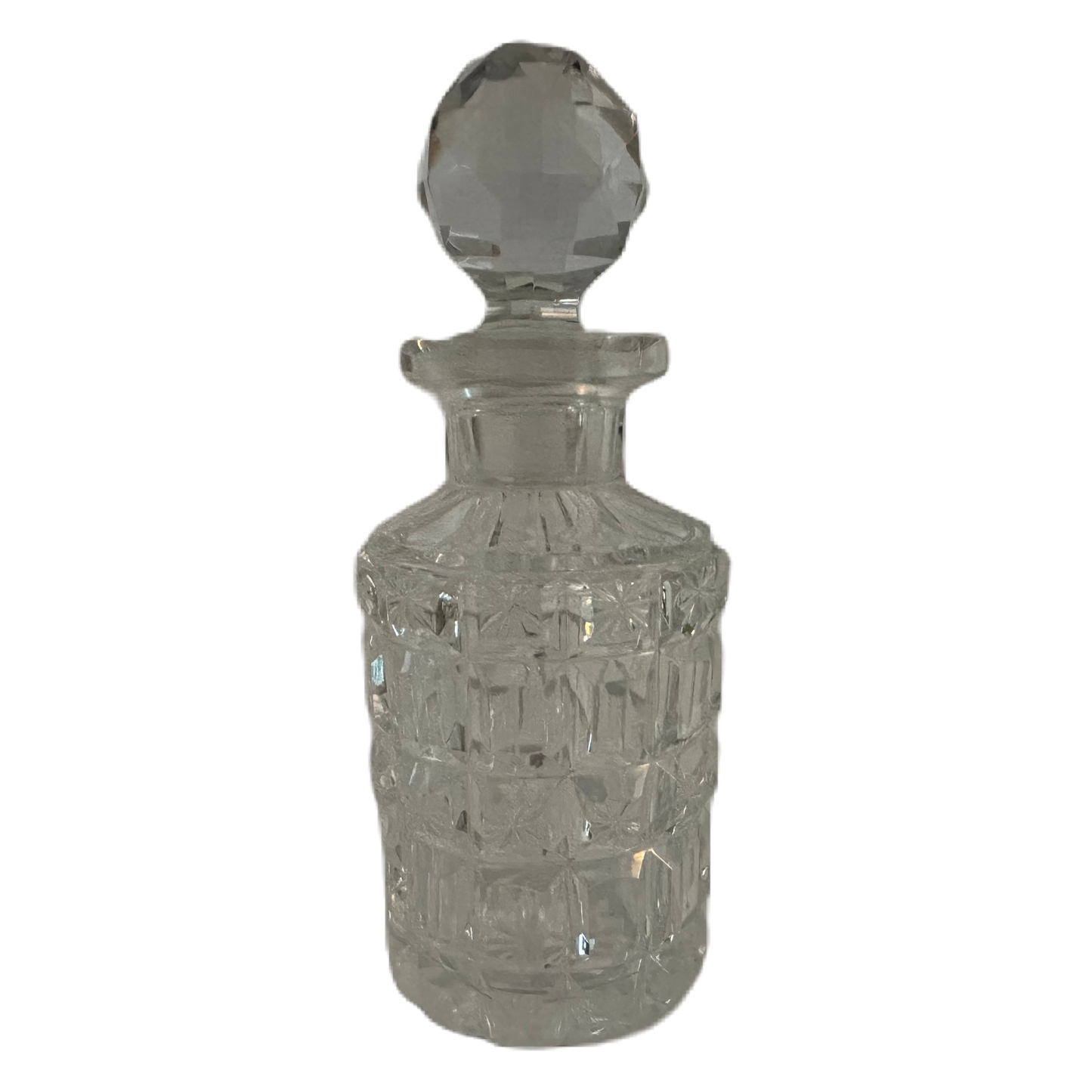 Liten flakong i glas med propp och slipat rutmönster.