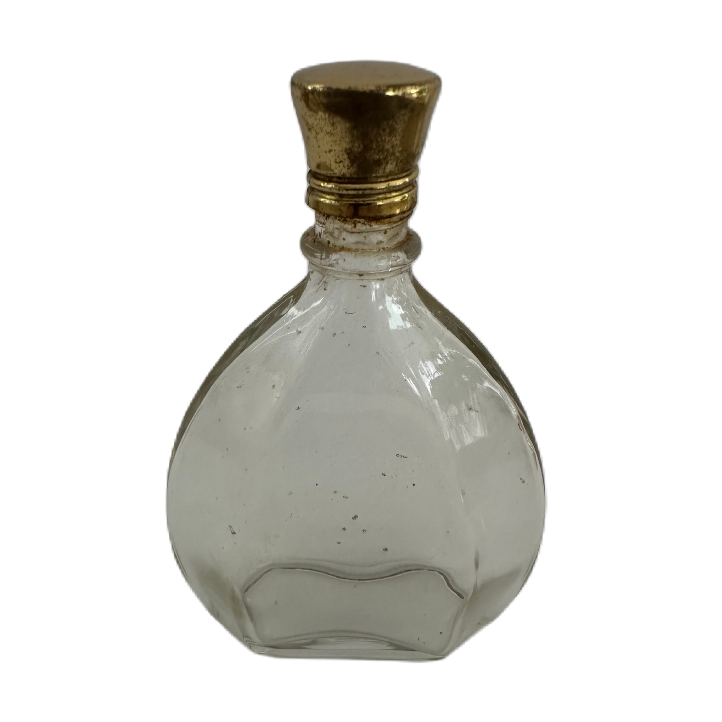 Liten parfymflaska i glas med guldfärgad metalkork.