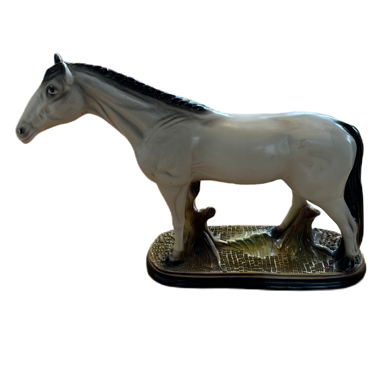 Figurin i keramik för dekoration, föreställande en vit häst.