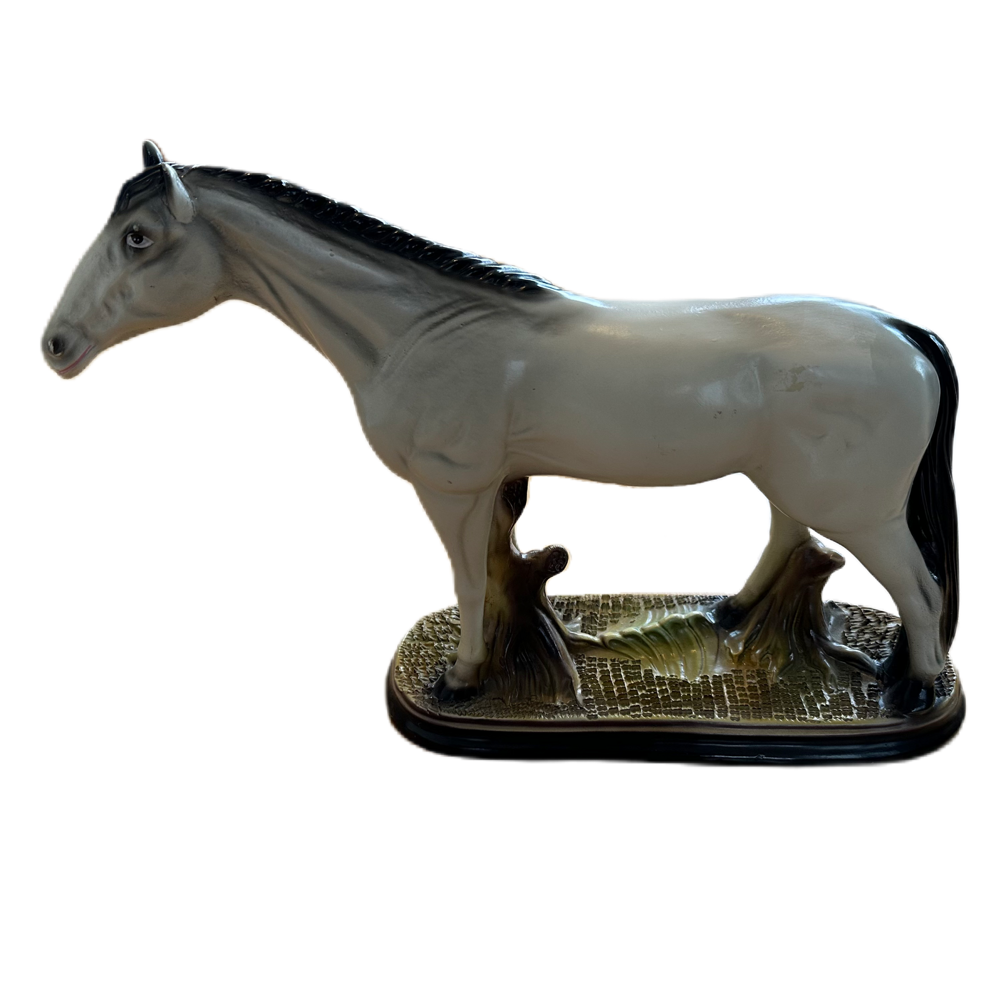 Figurin i keramik för dekoration, föreställande en vit häst.