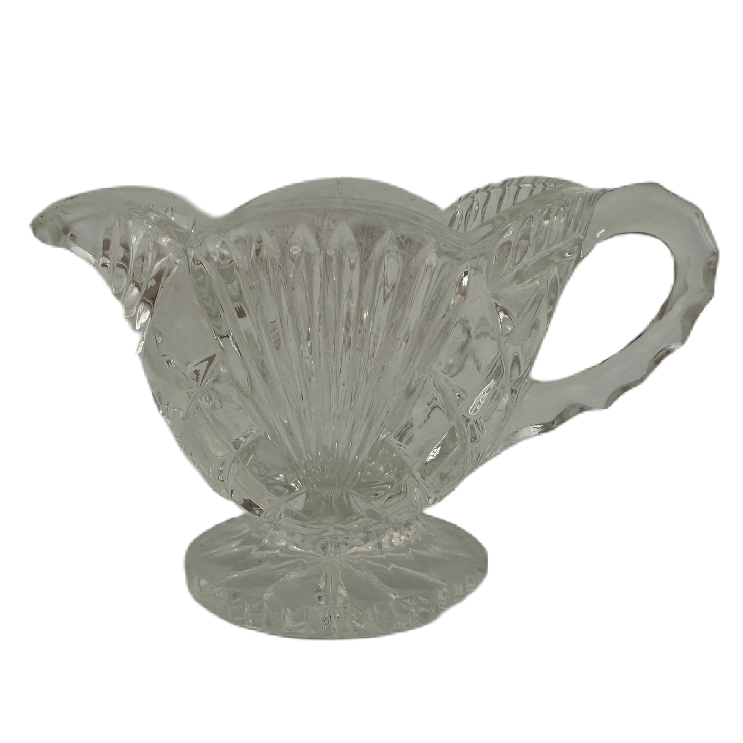 Båtformad gräddkanna i pressglas med slipat mönster.