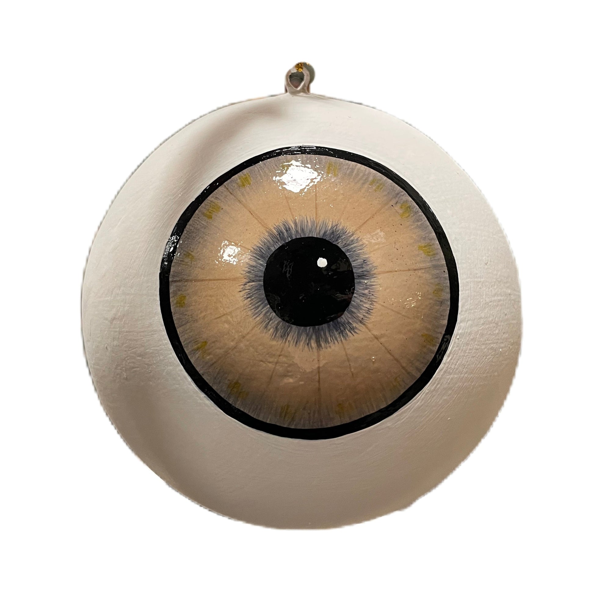 Hängdekoration från Filipiniana i form av ett stort öga med brun iris.