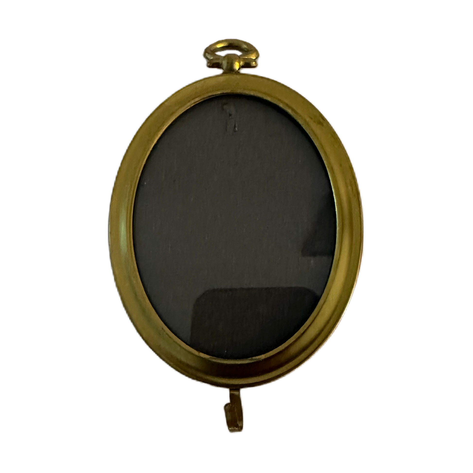 Liten, oval ram i guldfärg med krok.